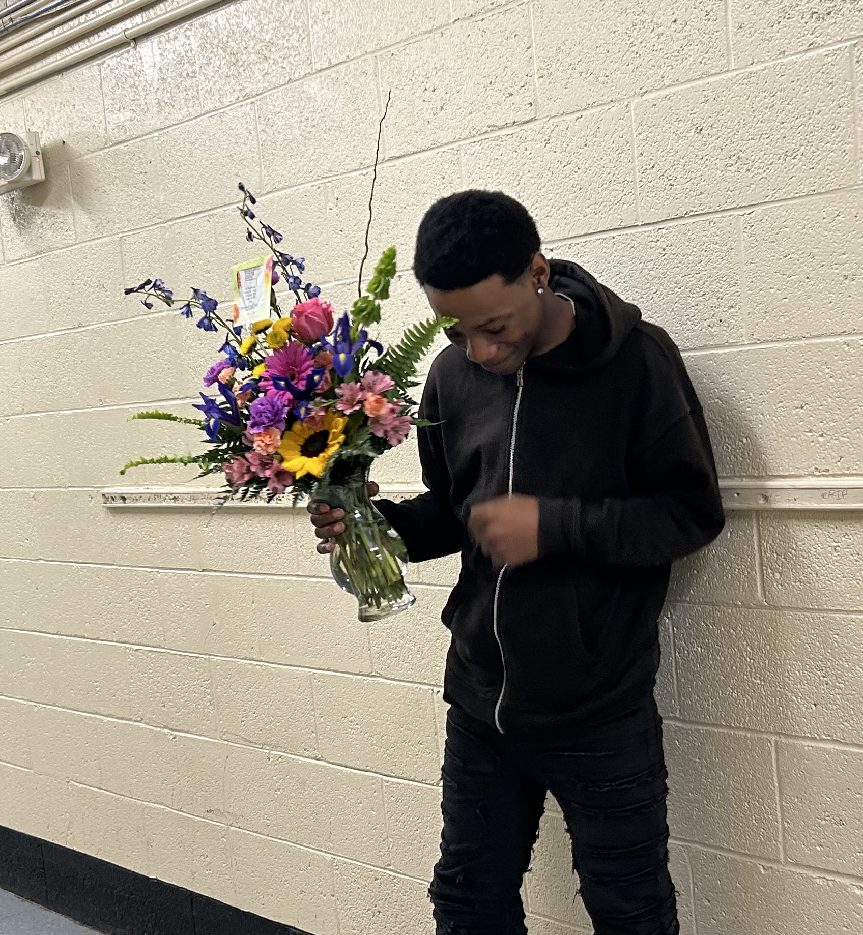 Student waiting to present Dr. Faulkner with her flowers for National Principals Day