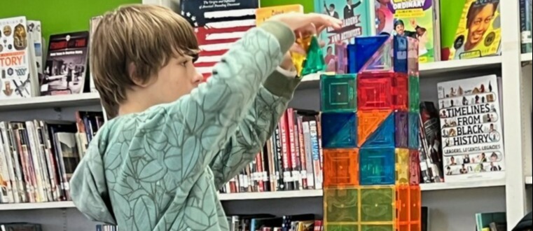 Color photo of student using tower builder