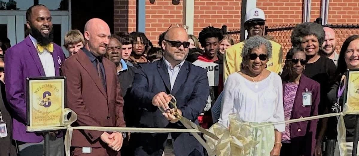 Color  photo of ribbon cutting 