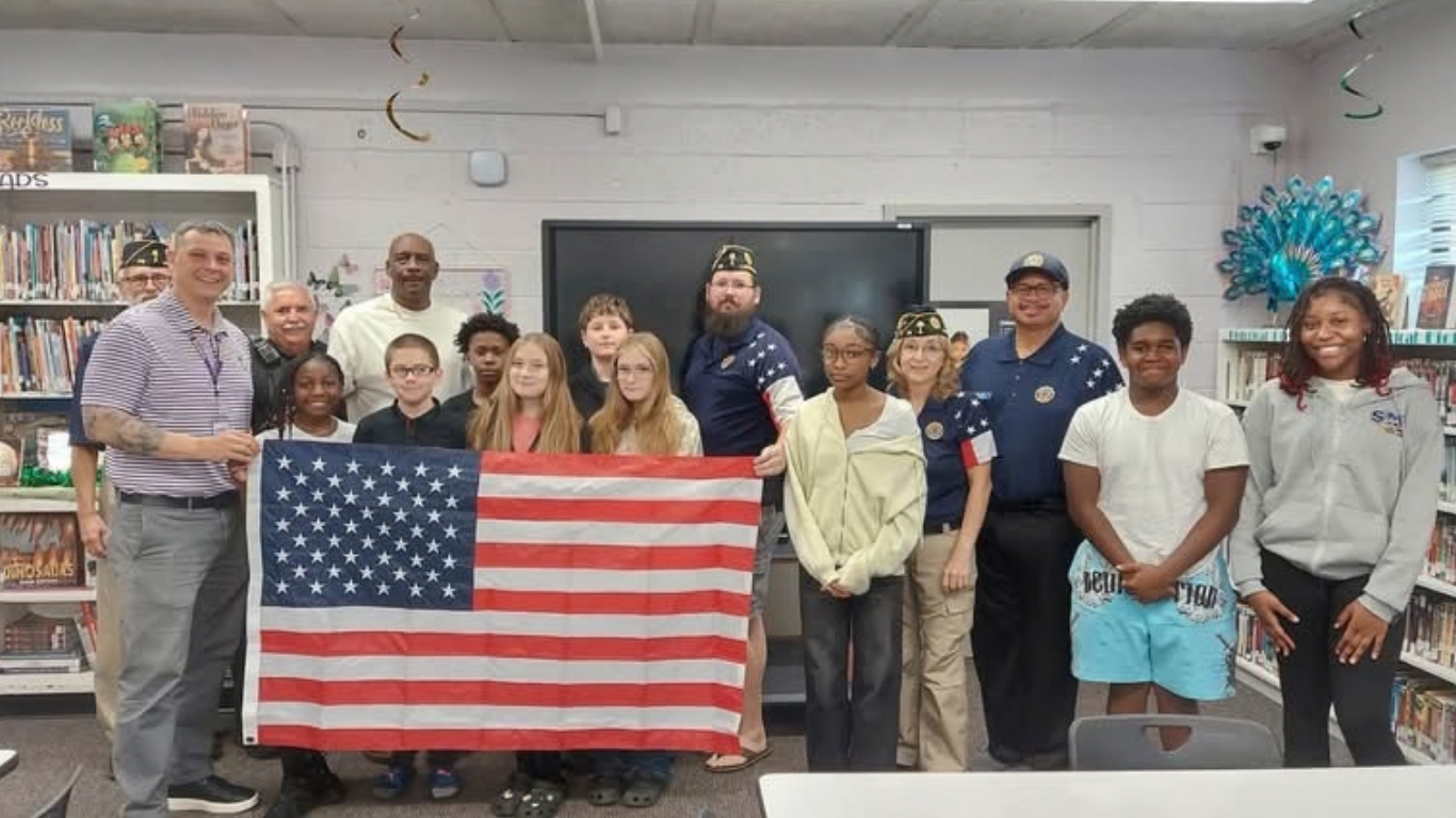 Color photo of students with members of American Legion Post 25