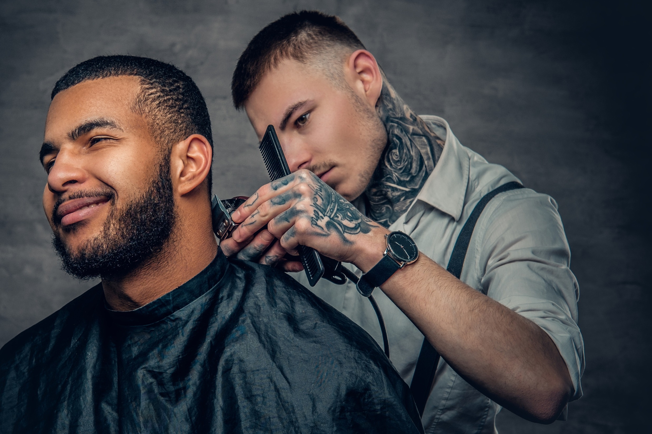 Man cutting another man's hair.