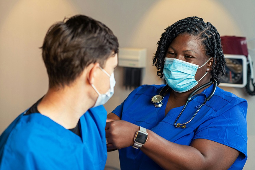 Picture of nurse practicing skills in classroom setting