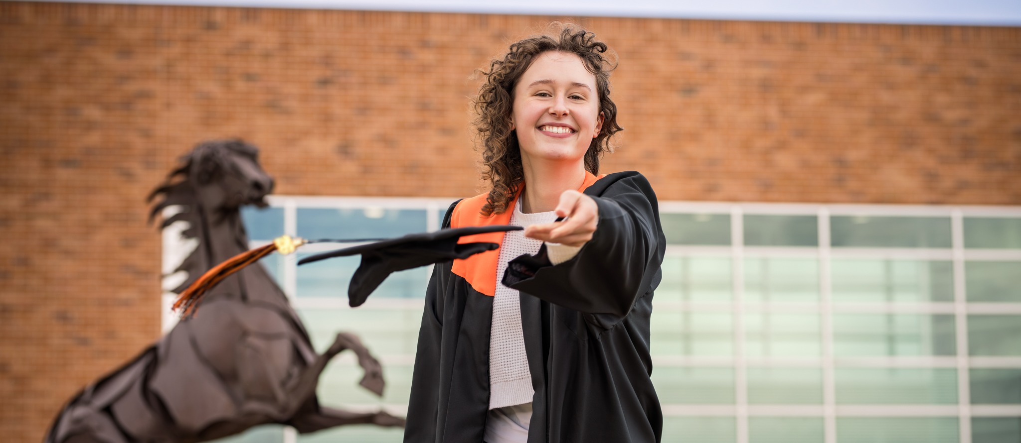 LPHS student with grad gown on