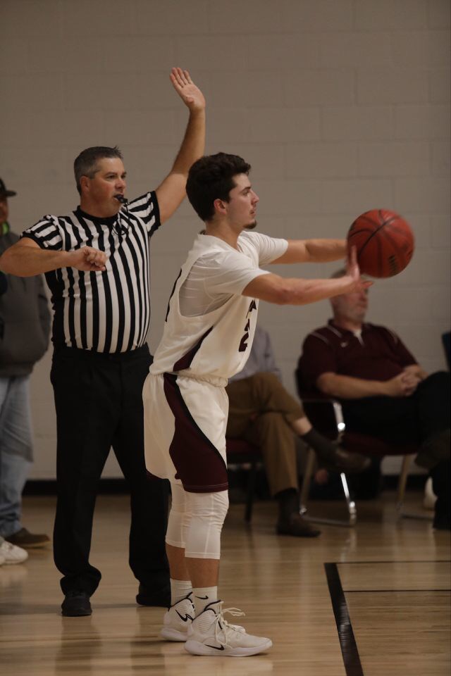 A photo of the boys basketball team playing.