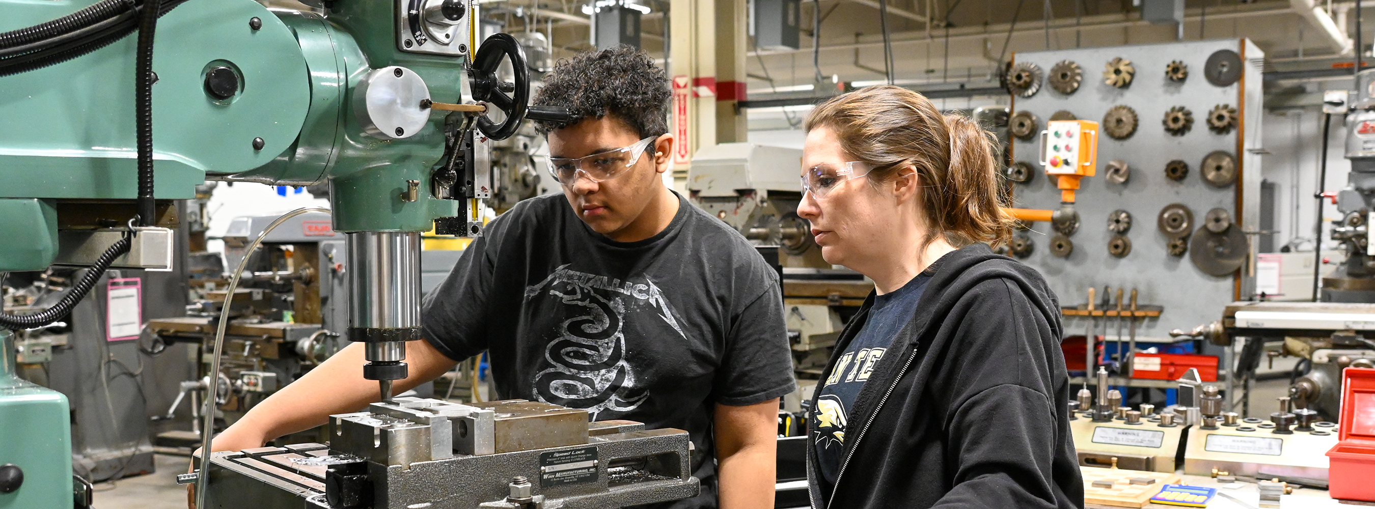 Student and instructor in advanced manufacturing