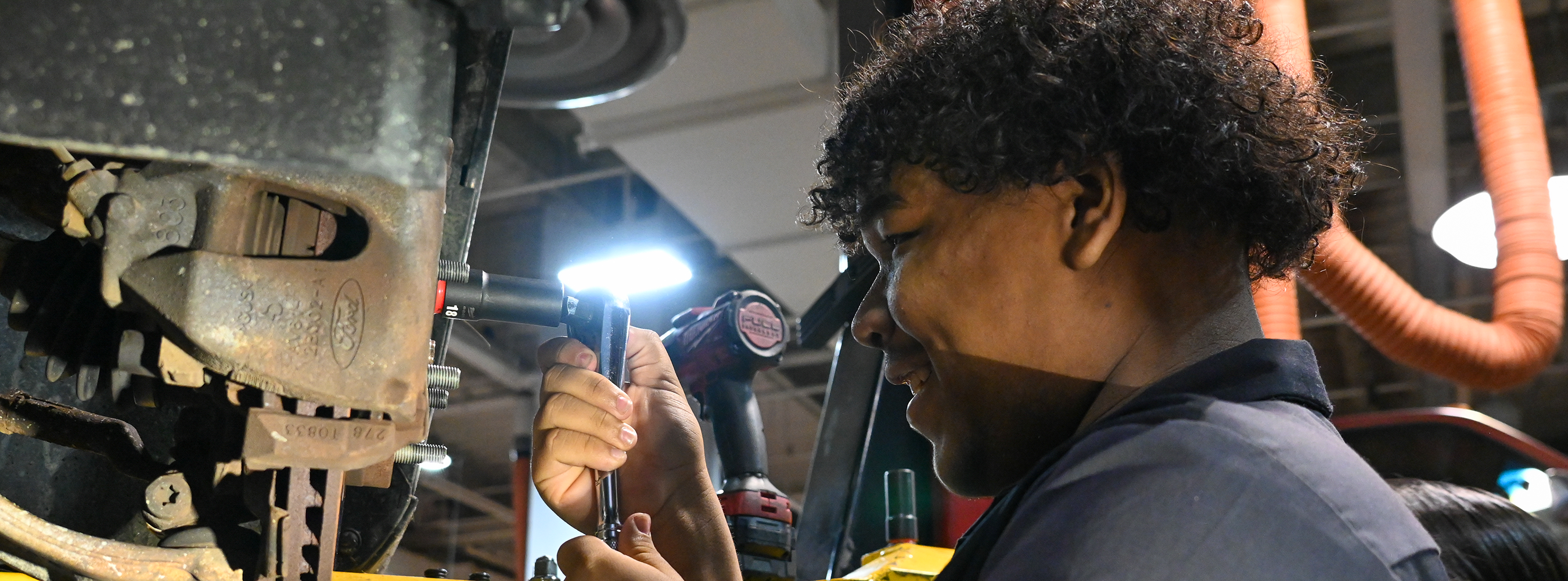 A student works on an engine