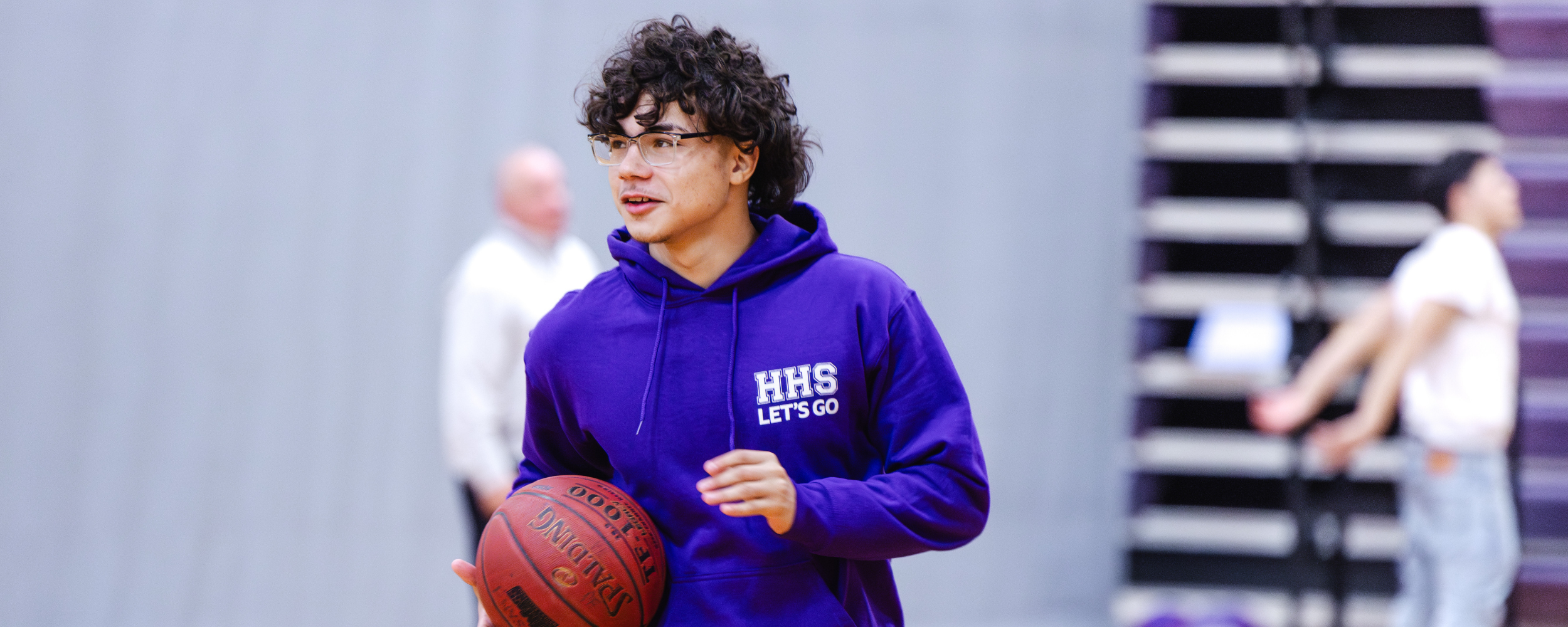 A student with a basketball during physical education
