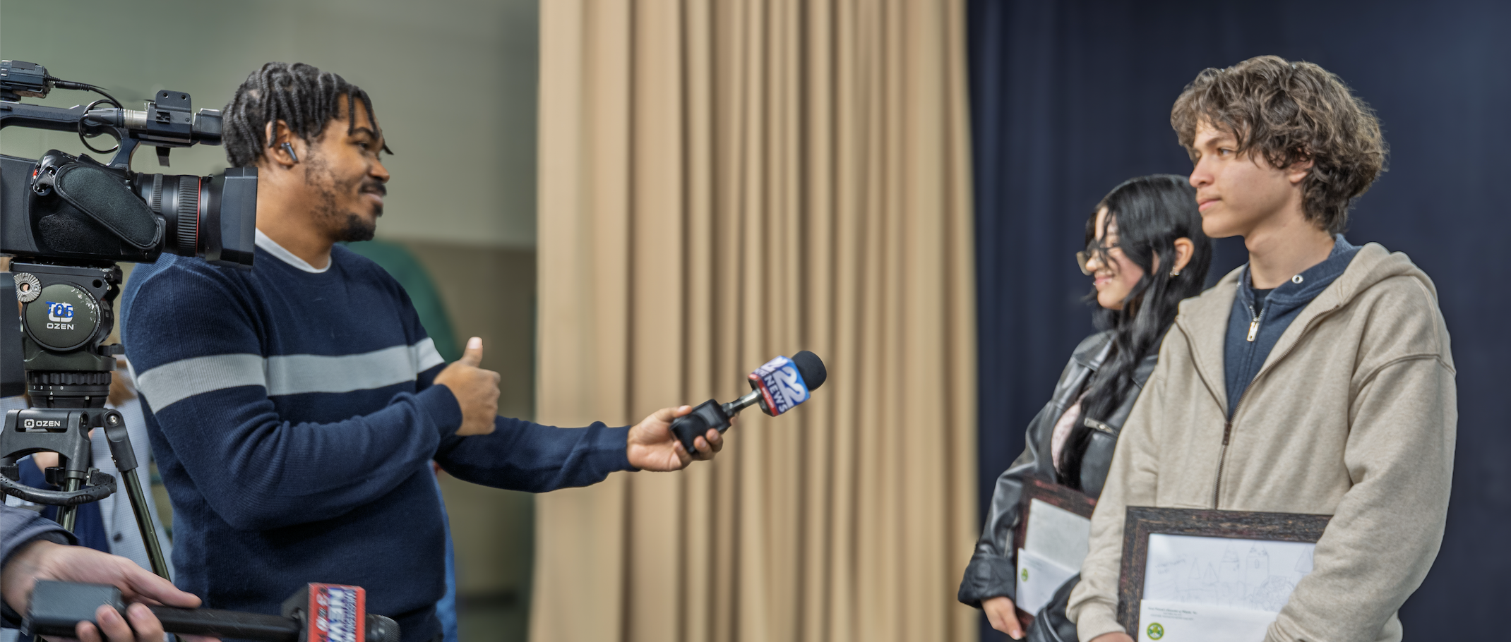 Two students are interviewed about their parade float design