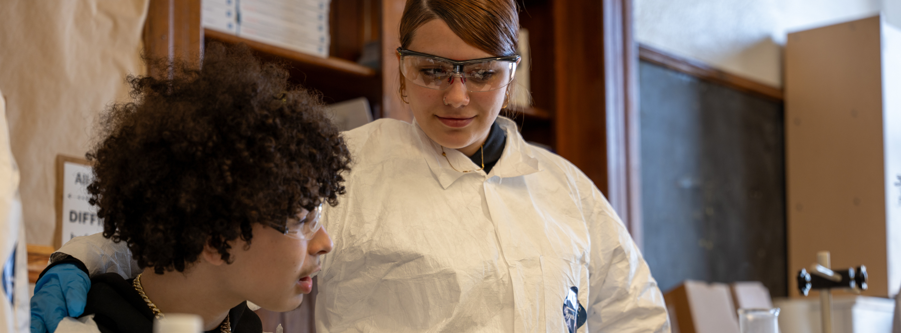 two students working on a science experiment