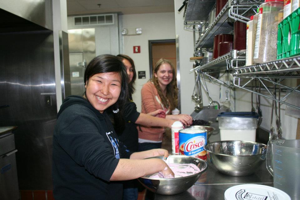 A photo of some student cooking.