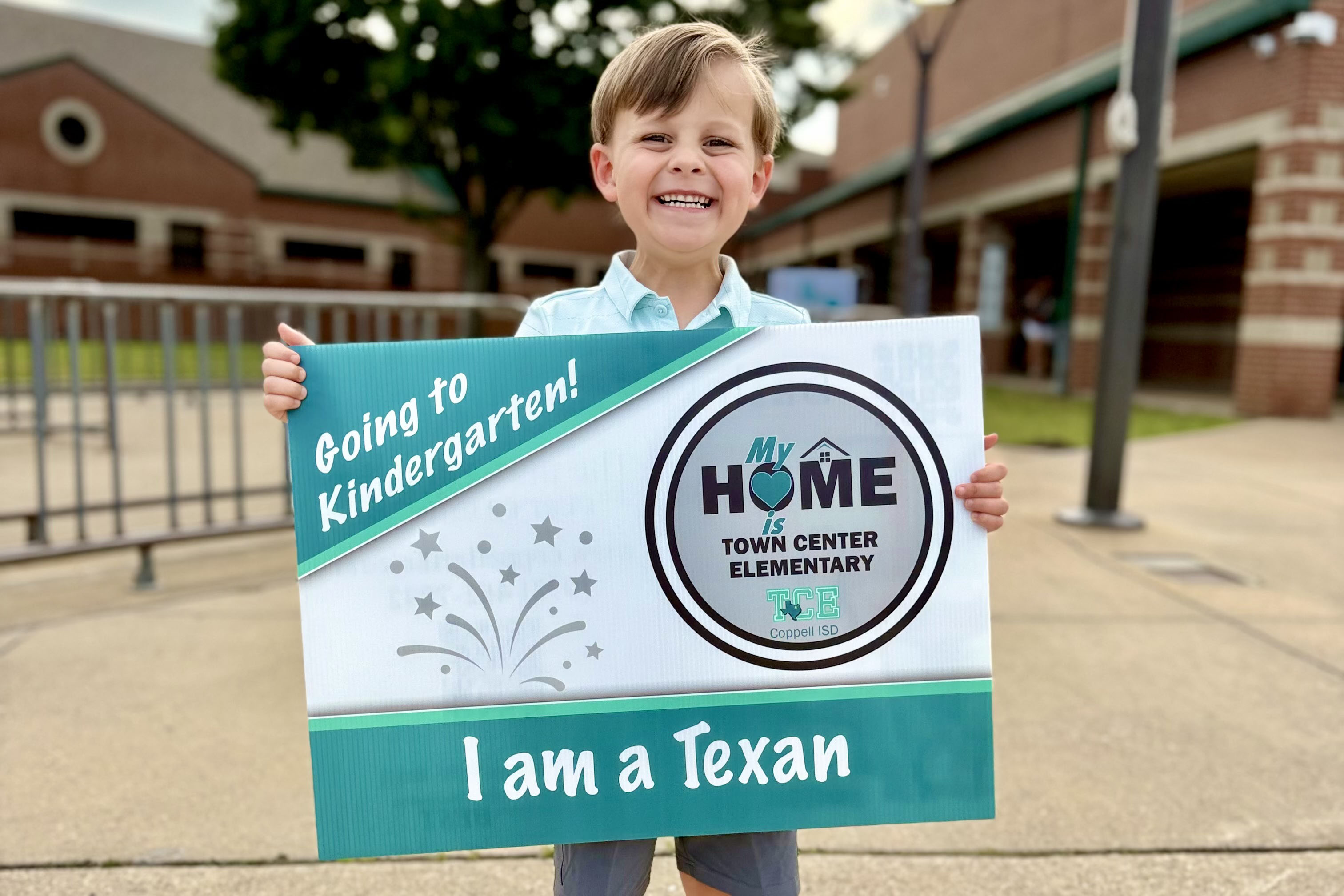 New kindergartener posing for photo during TCE Kinder Roundup