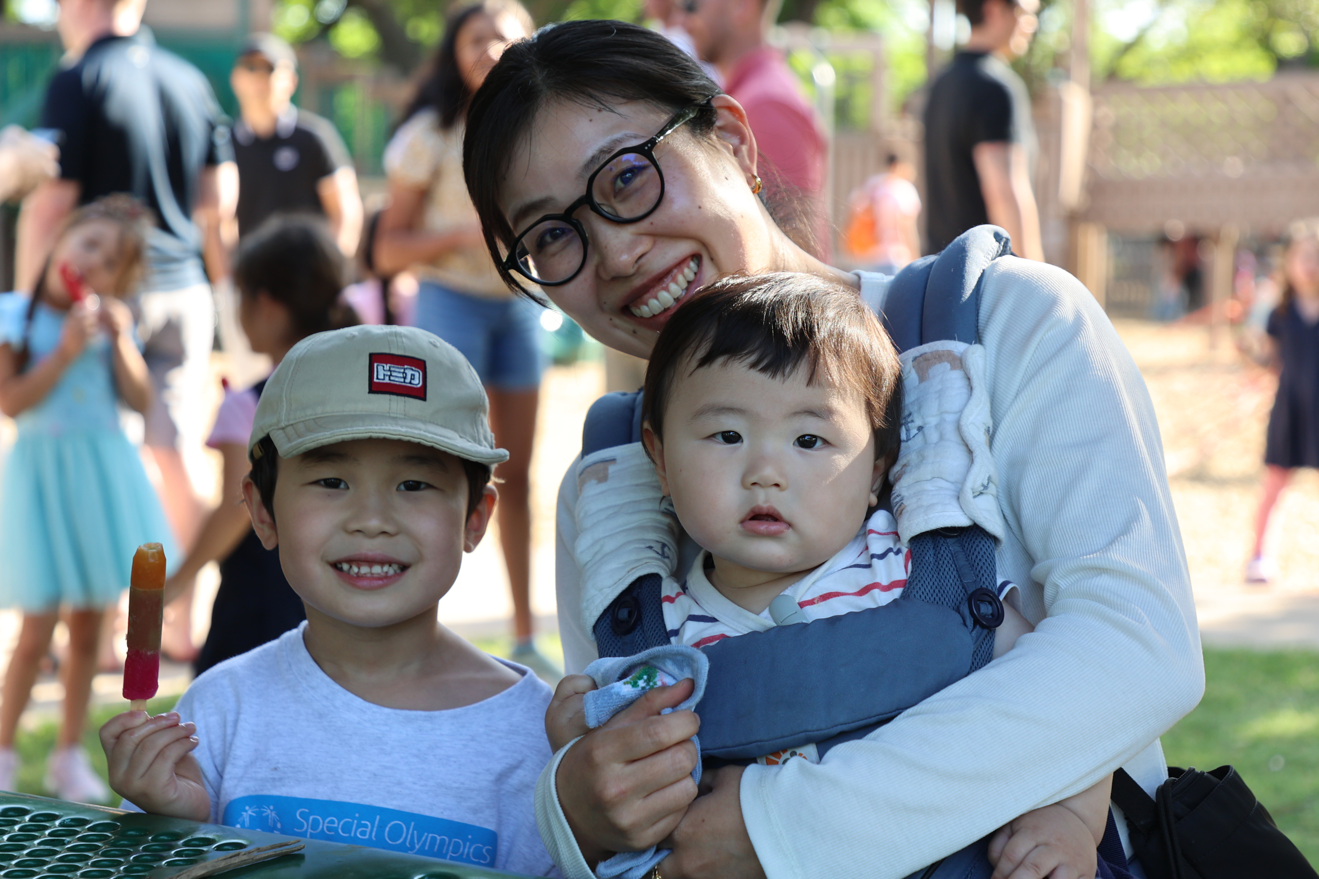 Future Kindergarten student with his mom and brother at the popsicle party