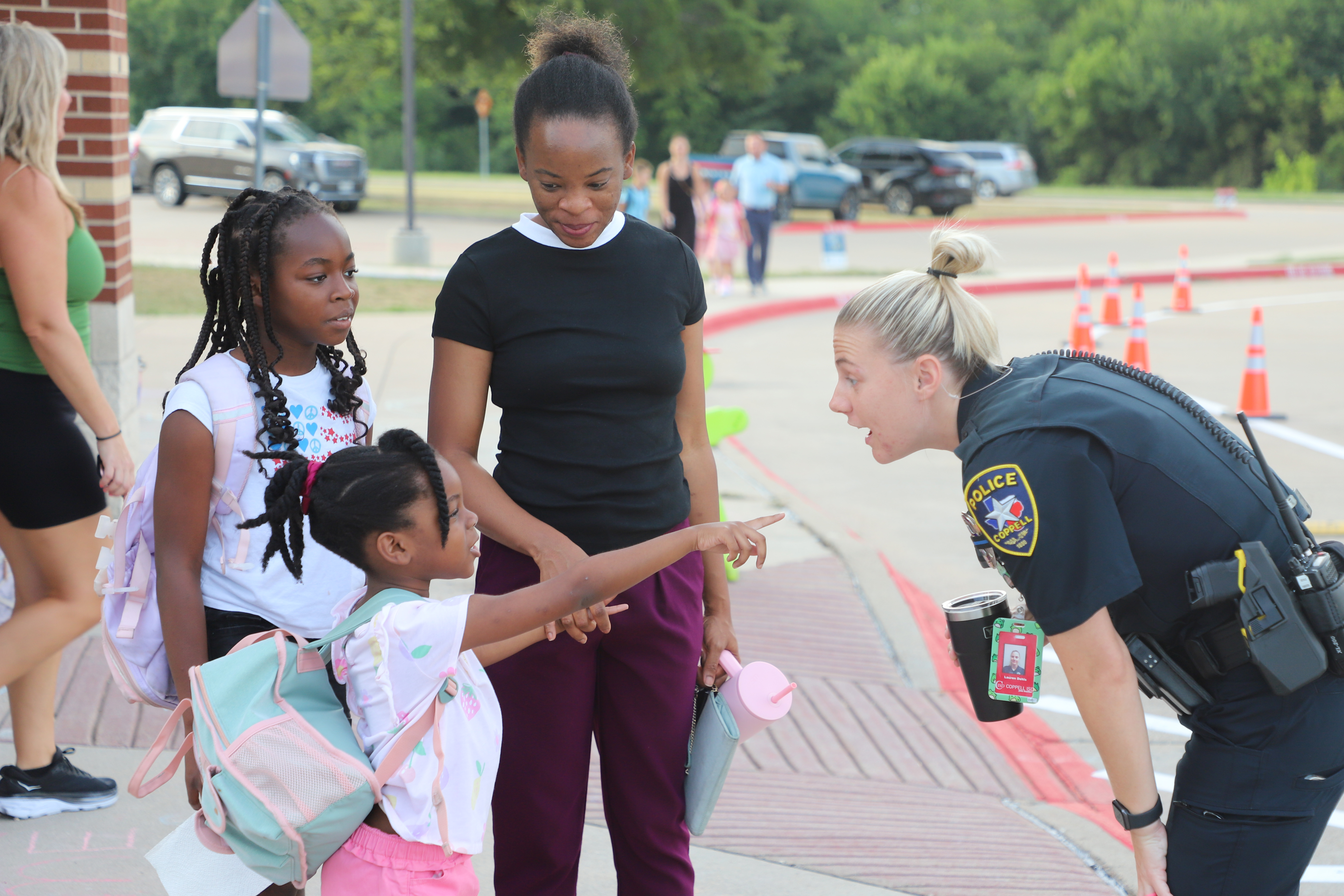 SRO Dehls welcoming students back to school at DCE