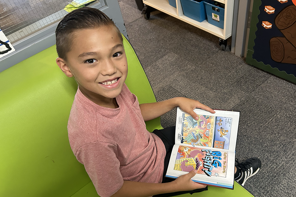 CCE student reading a book