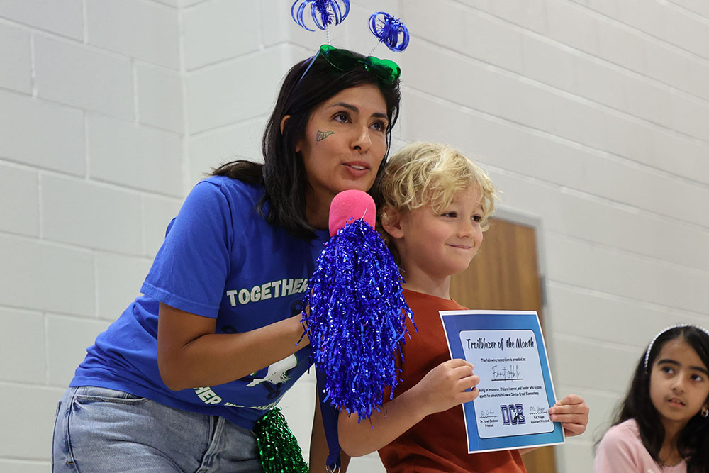 DCE teacher honoring her student as the student of the month picture