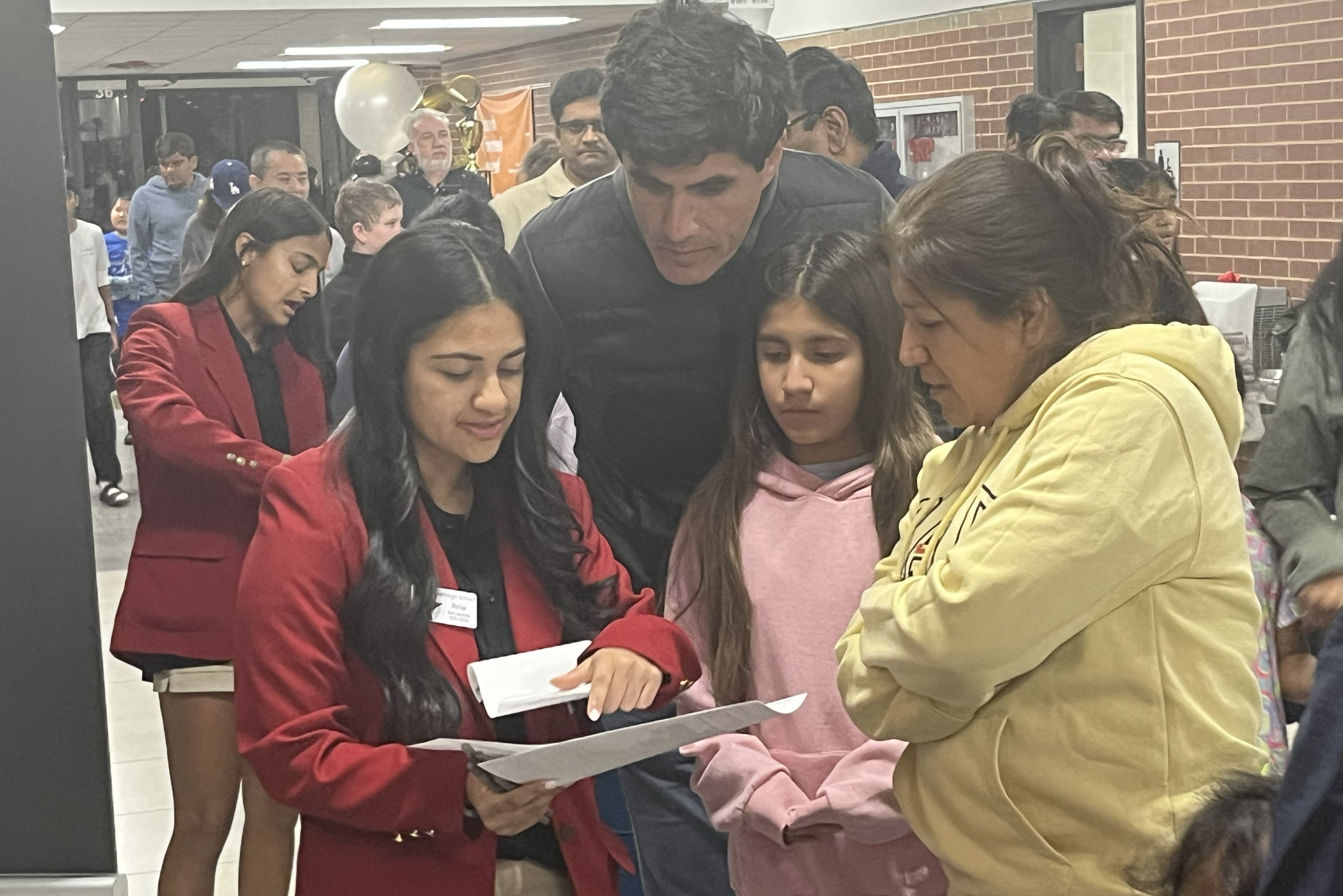 Red Jackets directing families duirng School Choice Fair