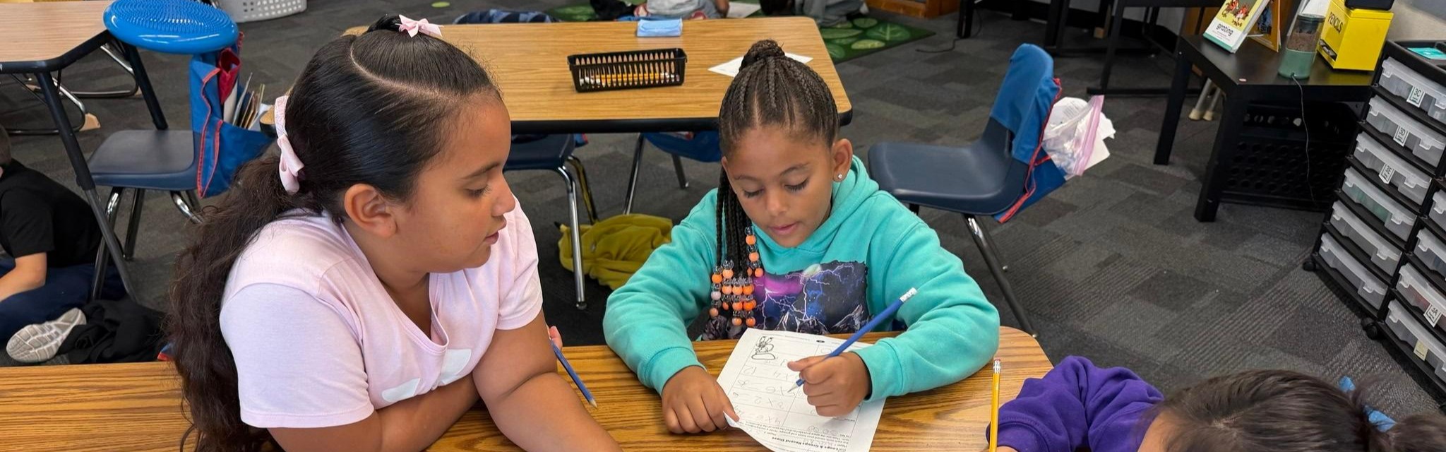 students at table learning