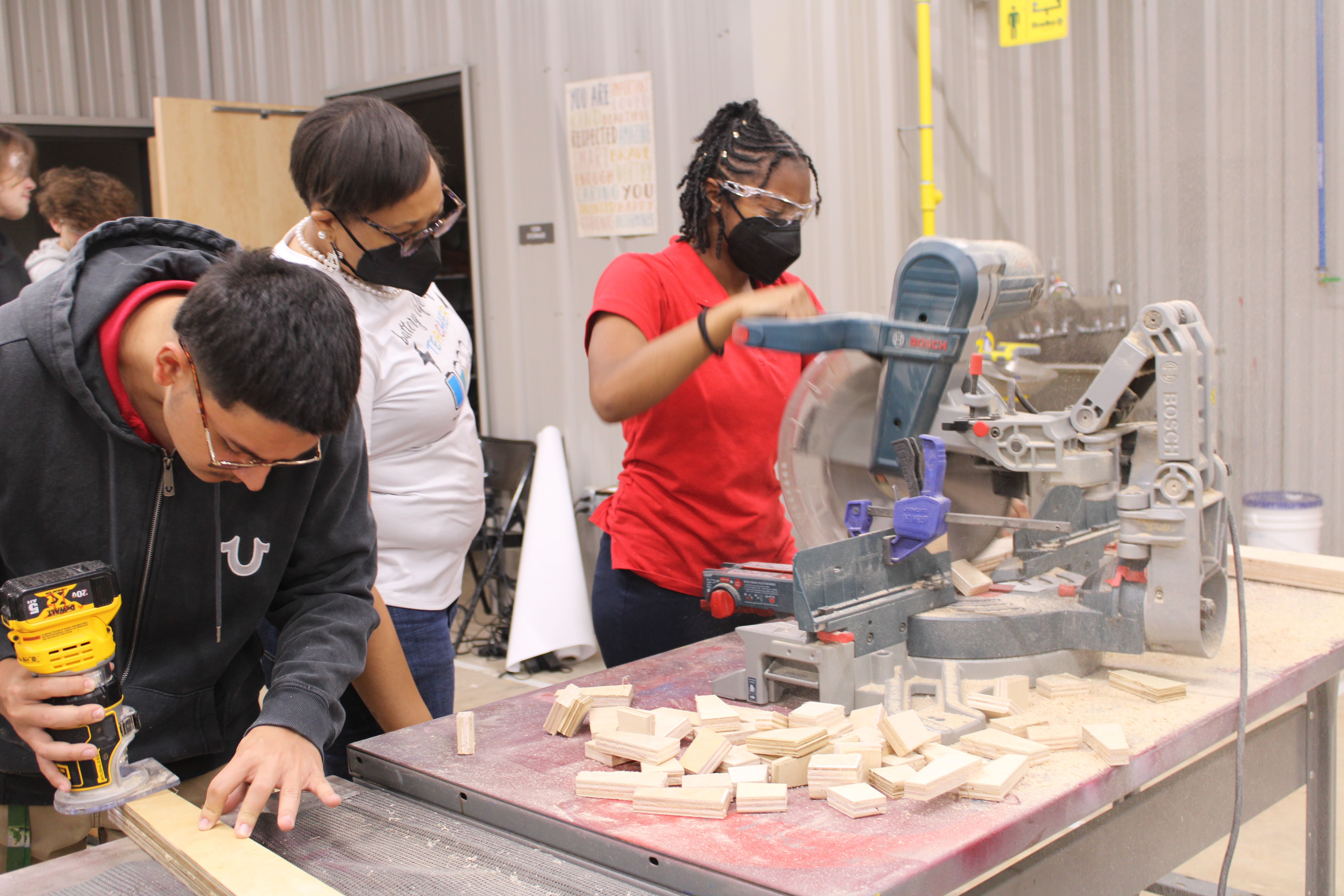 Industrial Maintenance Students standing with their bench.