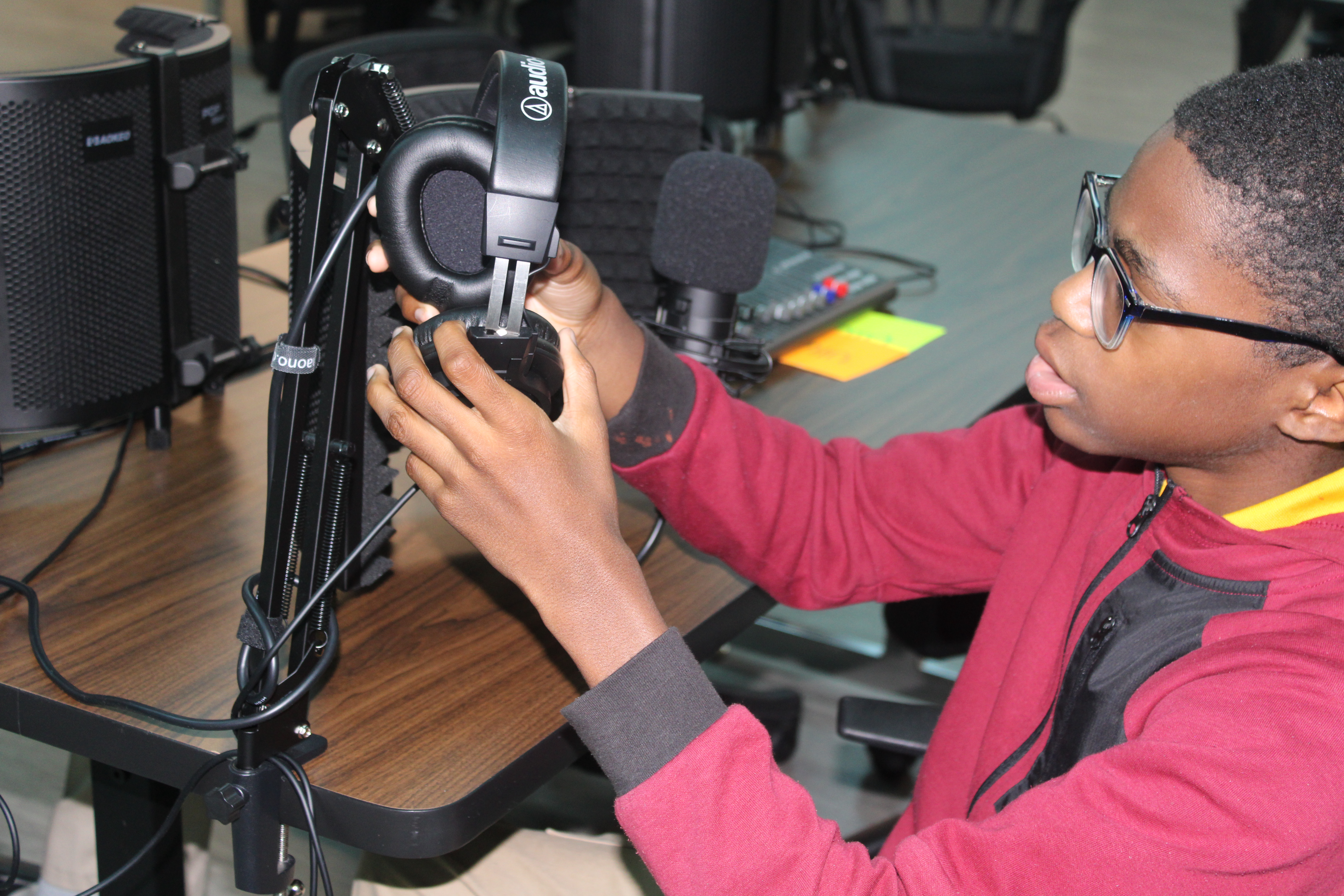 Information Technology students installing a cooling fan.