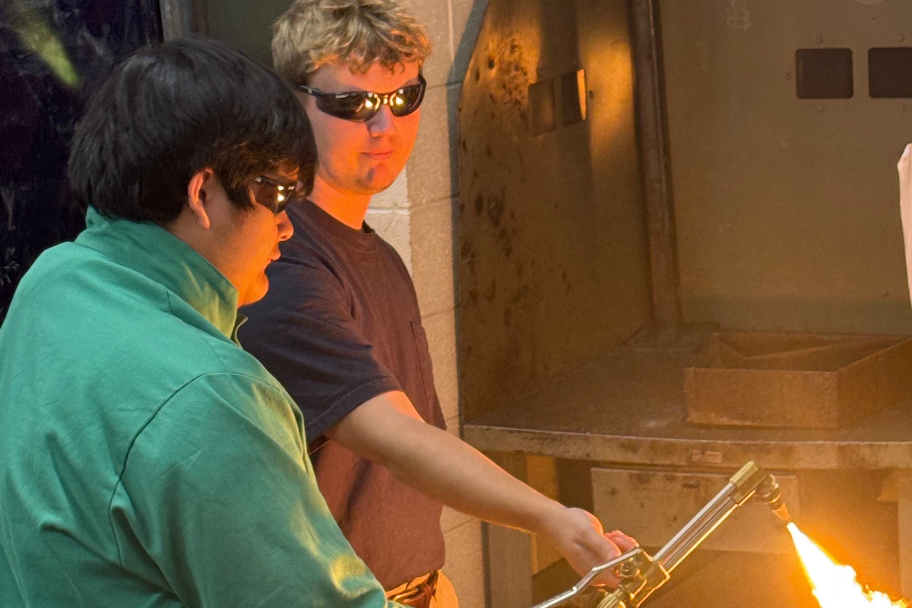 Industrial Maintenance Students standing with their bench.