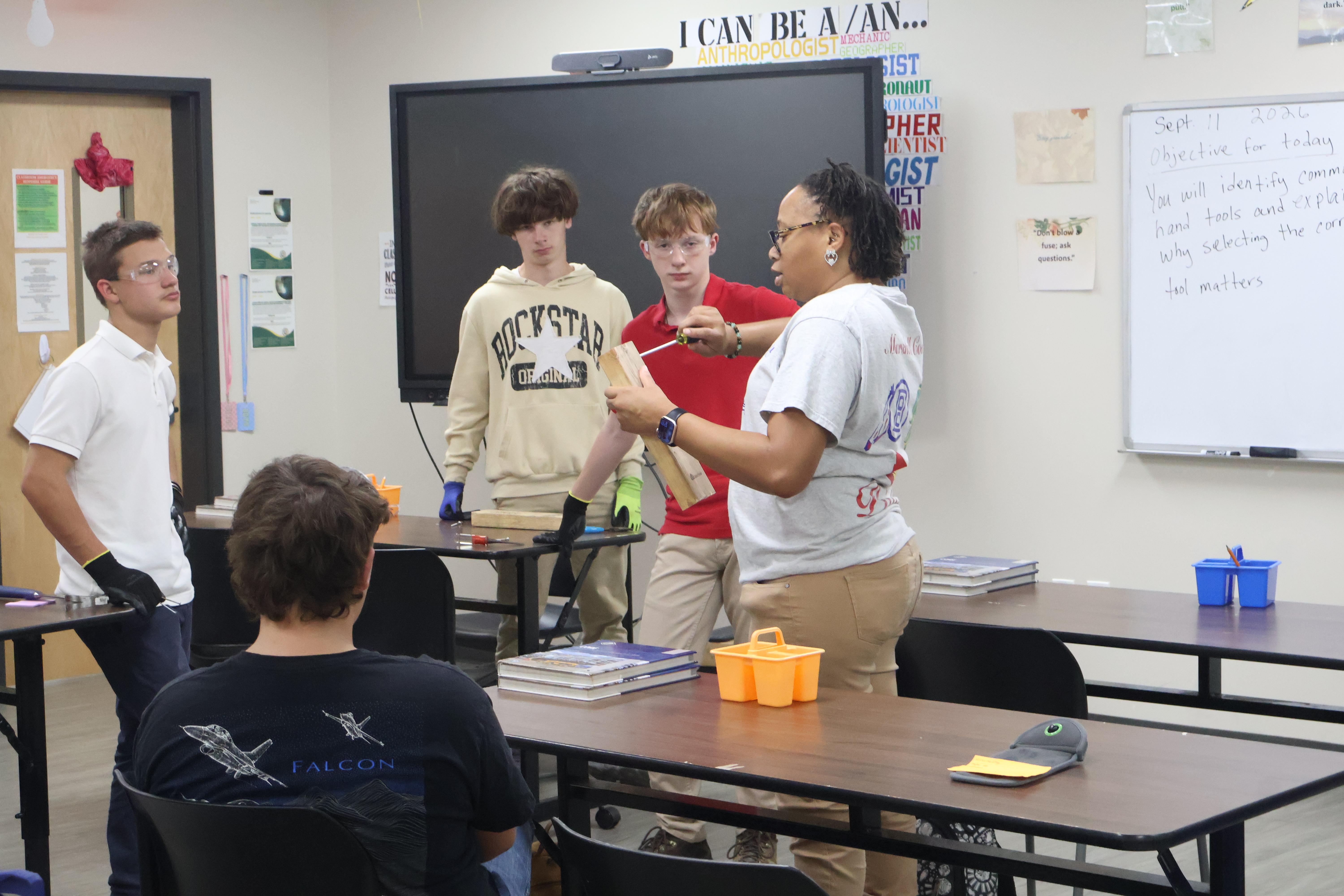 Mrs. Franklin demonstrating hand tools