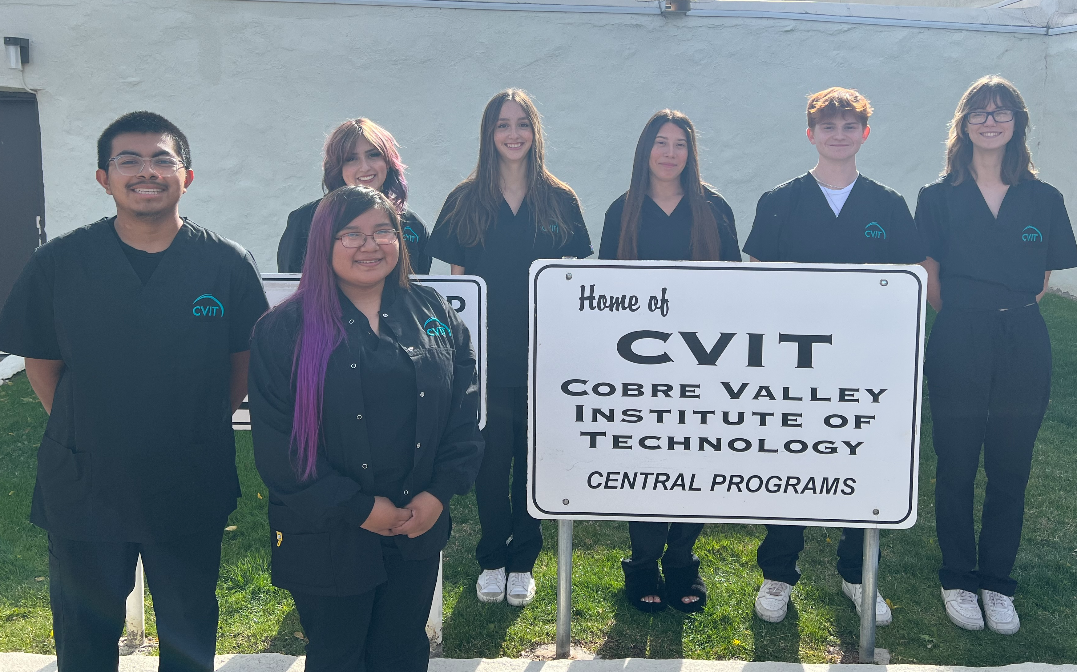 group of dental assistant students standing by CVIT sign