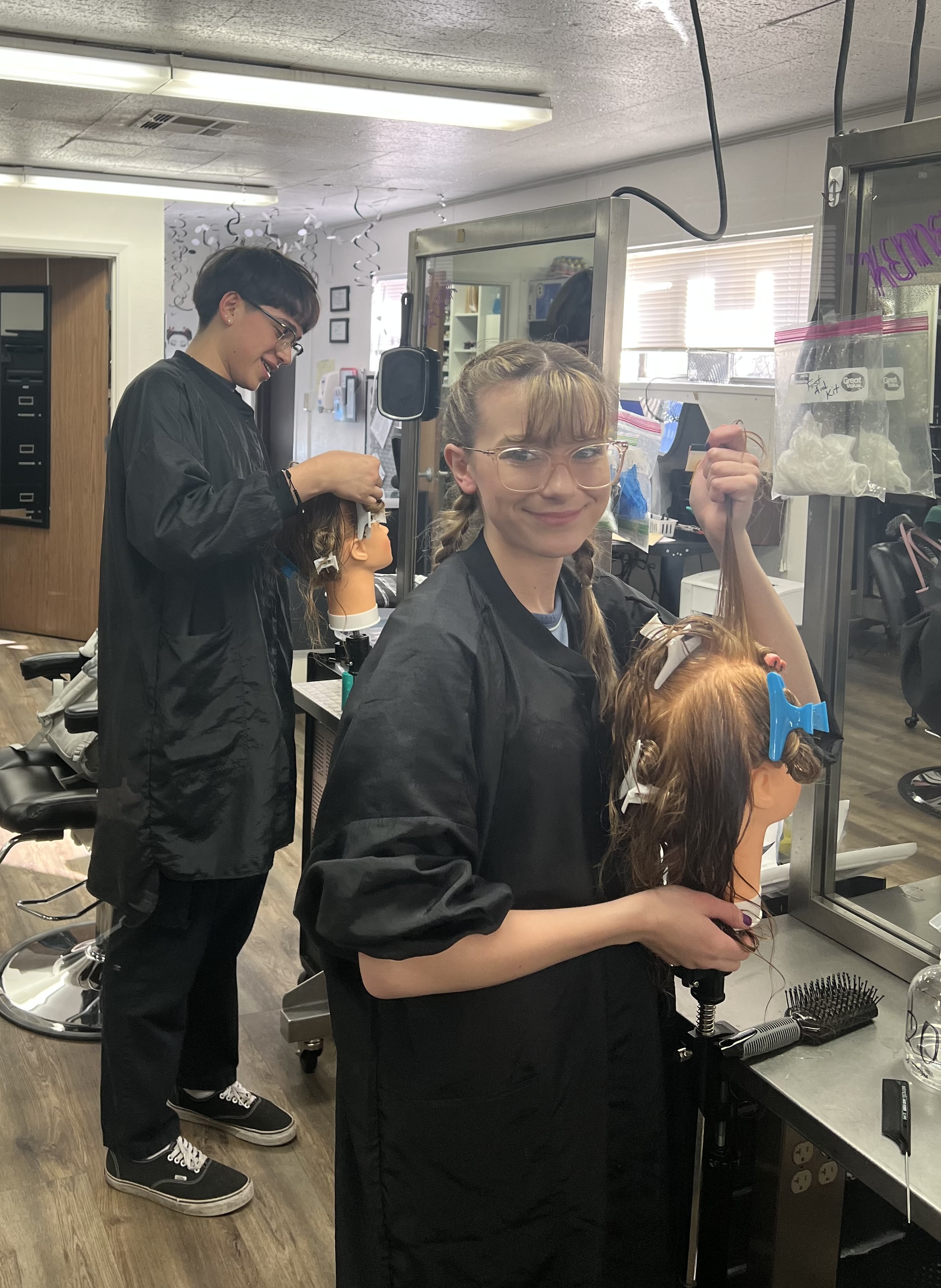 Cosmetology students working in salon