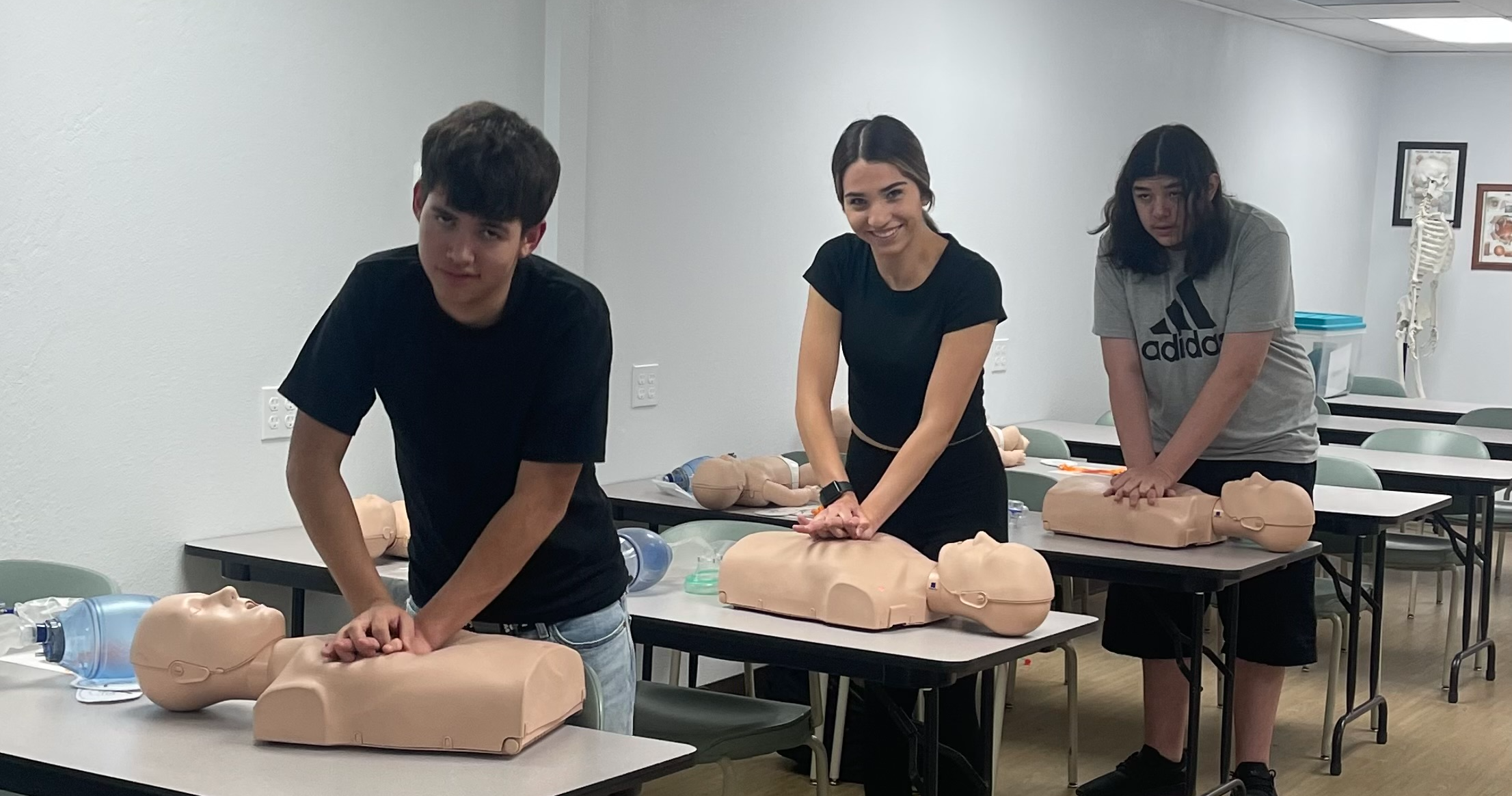 Students earning CPR certification