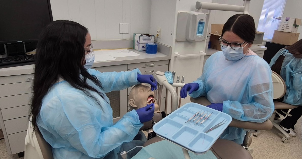 Dental Assistant students practicing instrument transfer