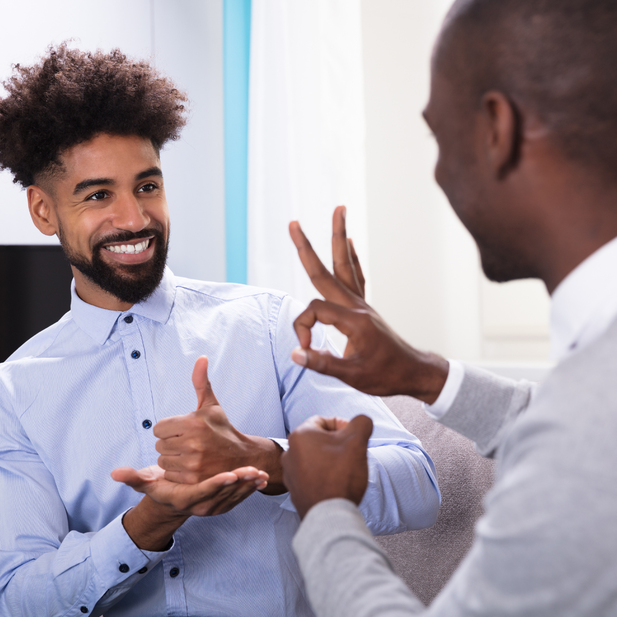 two black males using sign language