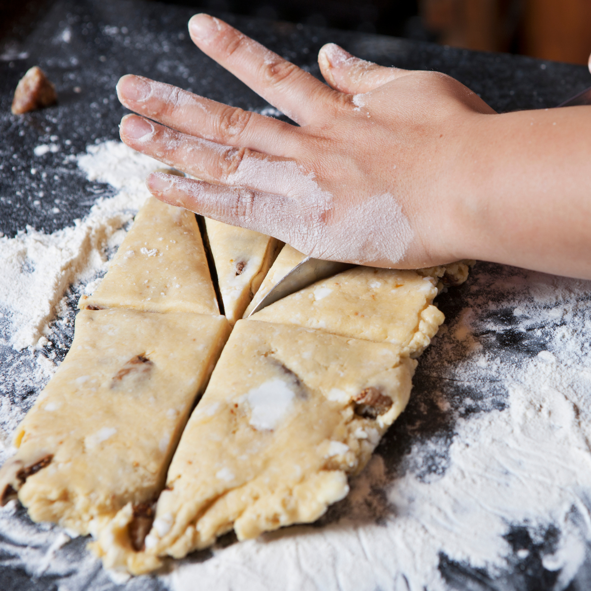 rolling out scones with flour