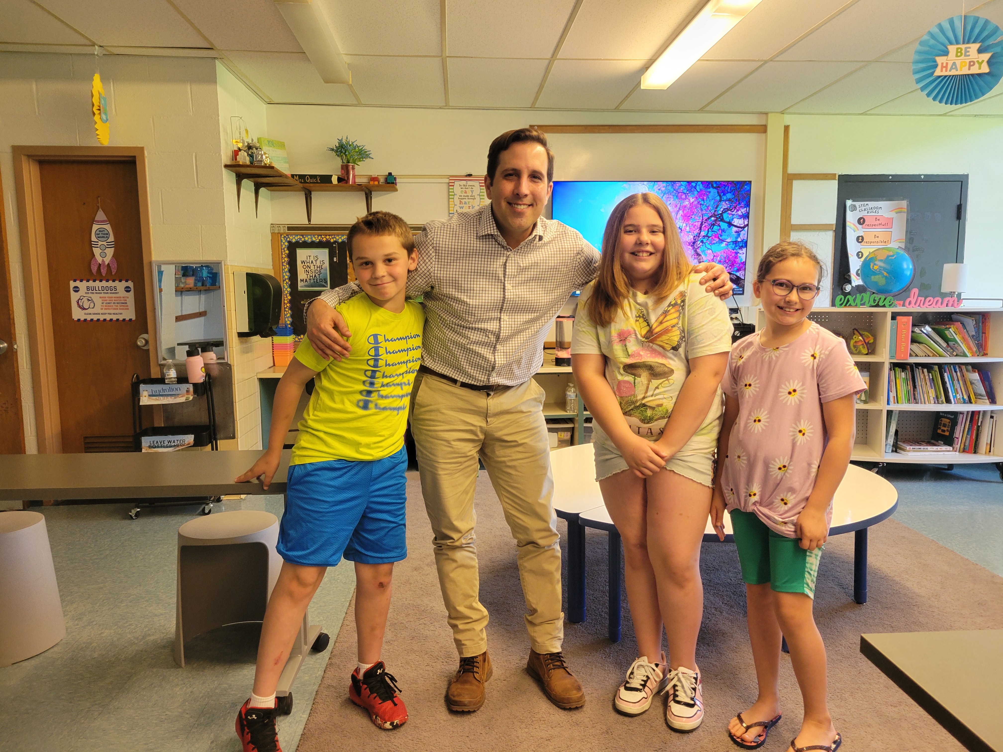 New principal Jerry Gibson stands with student council members
