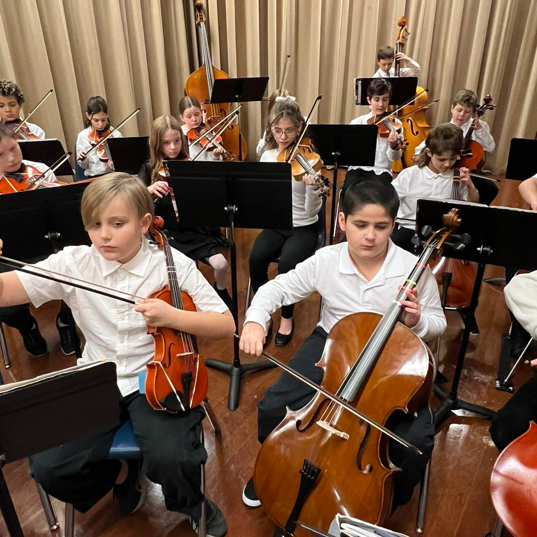 Two students play string instruments