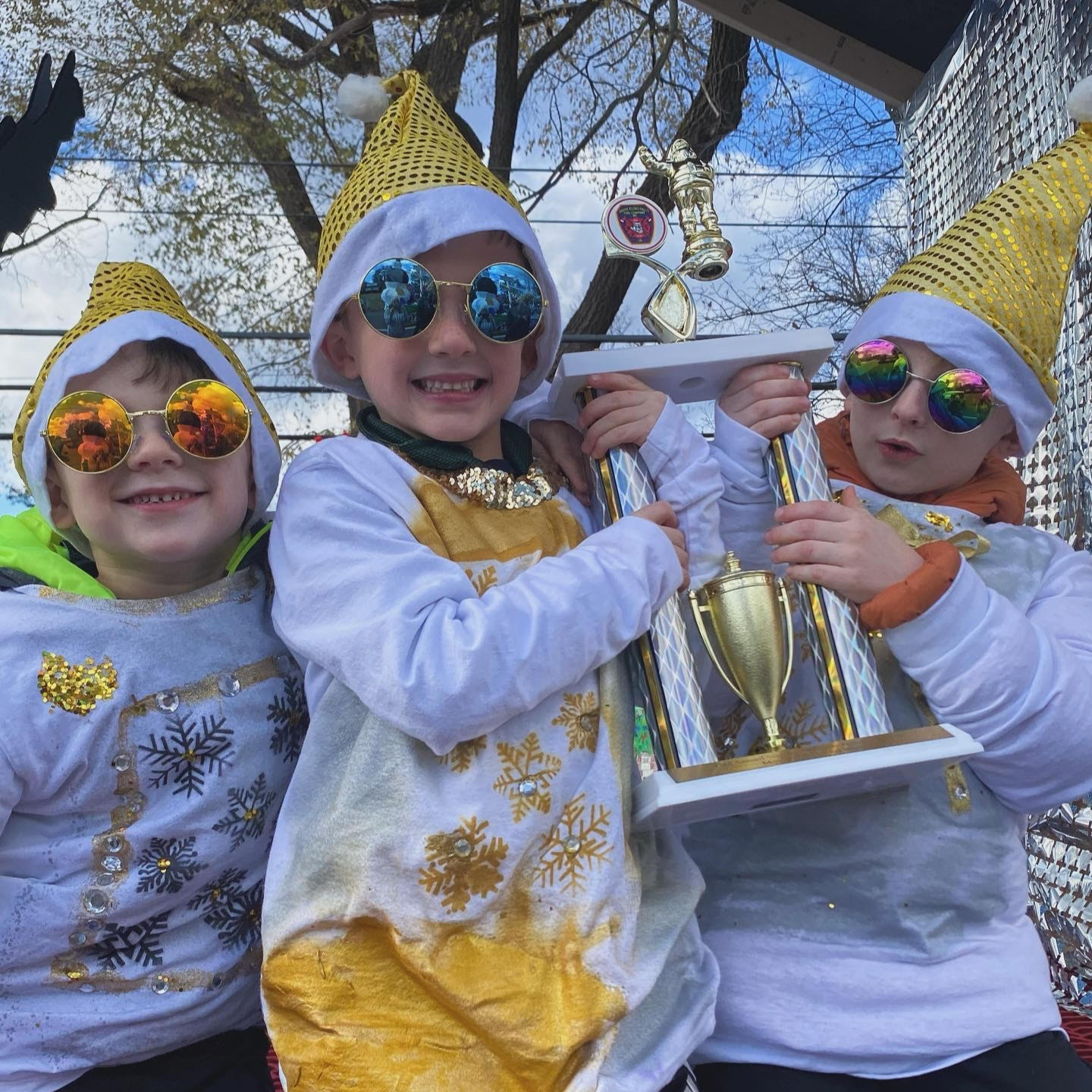 Students hold up a trophy