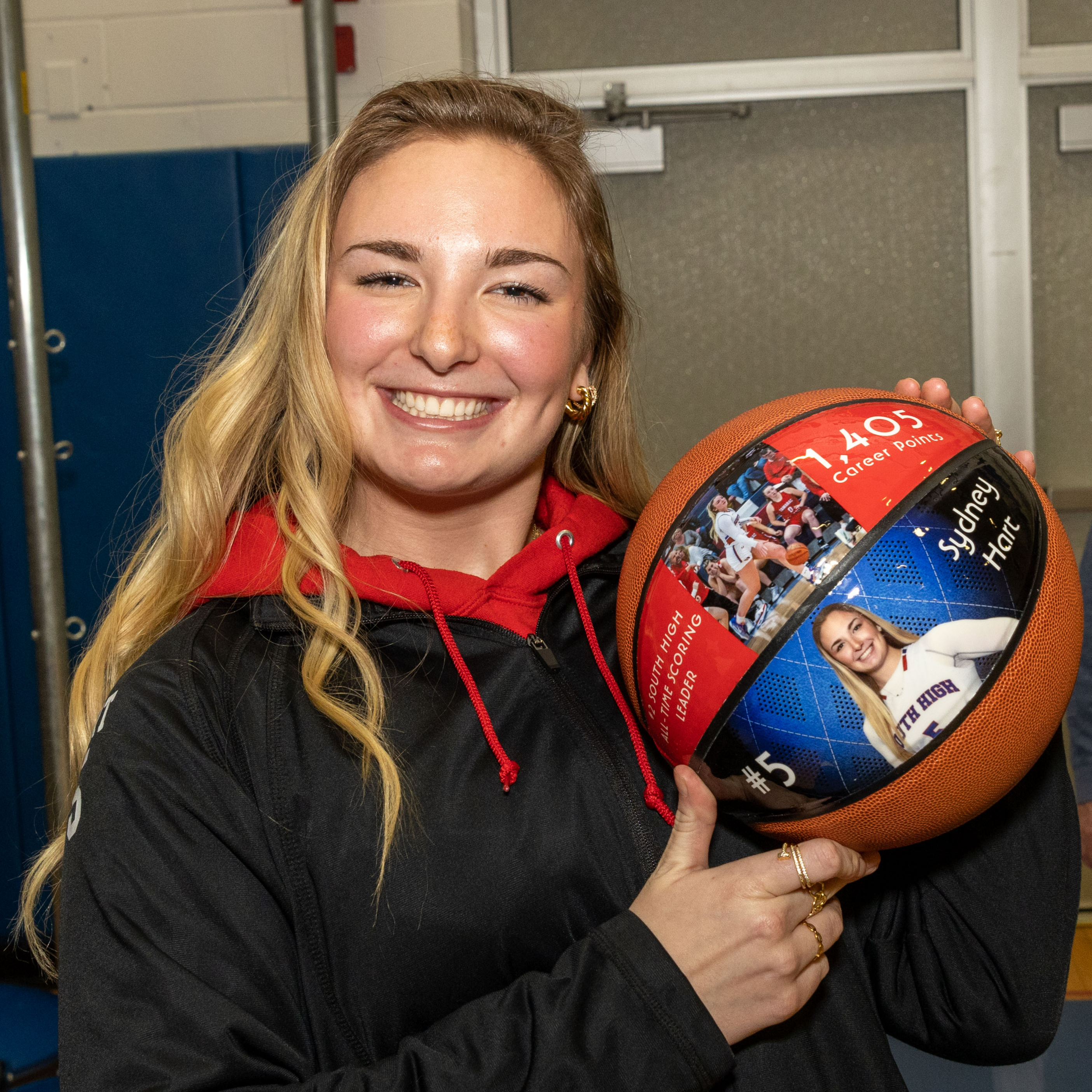 Sydney Hart holds a basketball