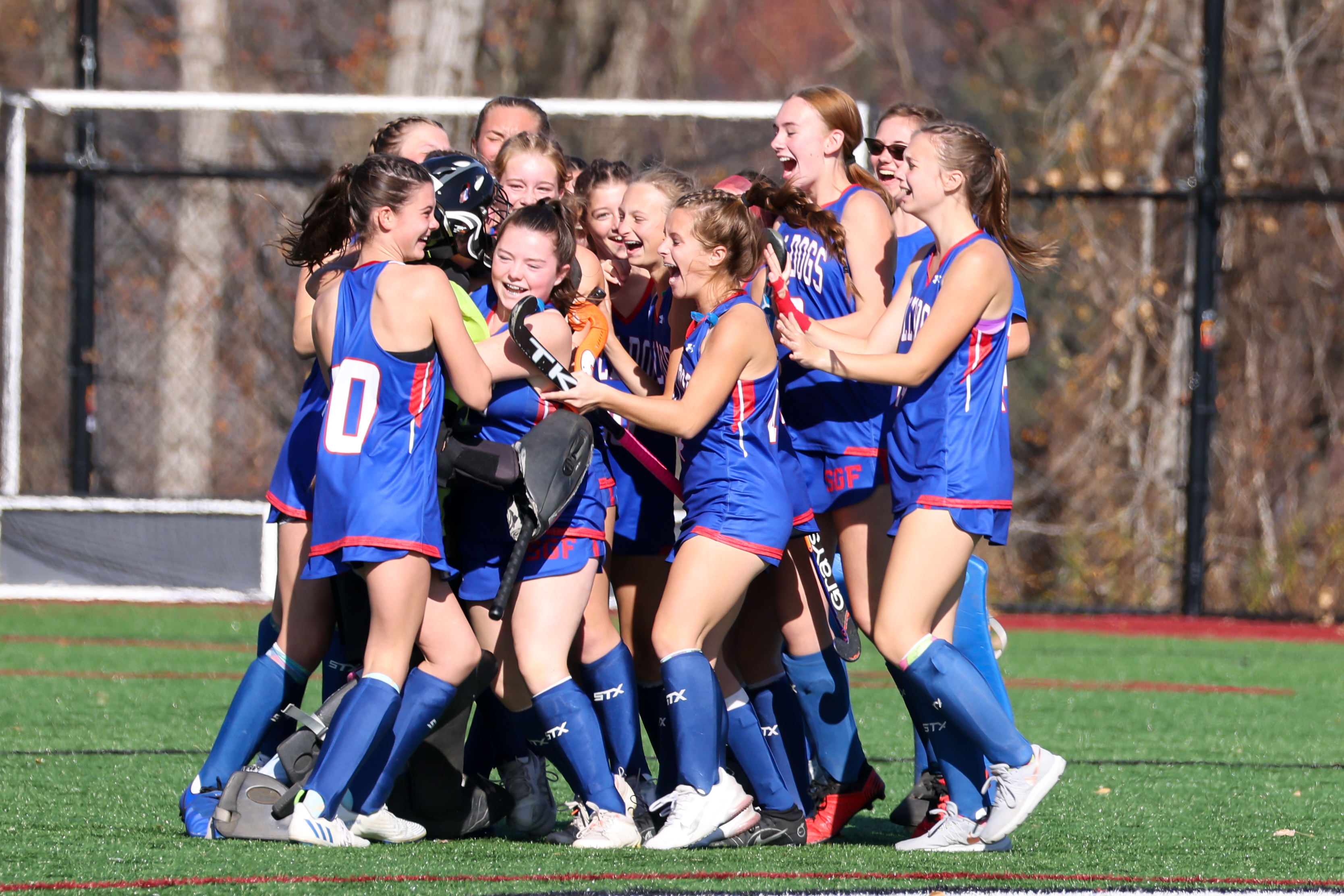 SGF field hockey team embraces and cheers