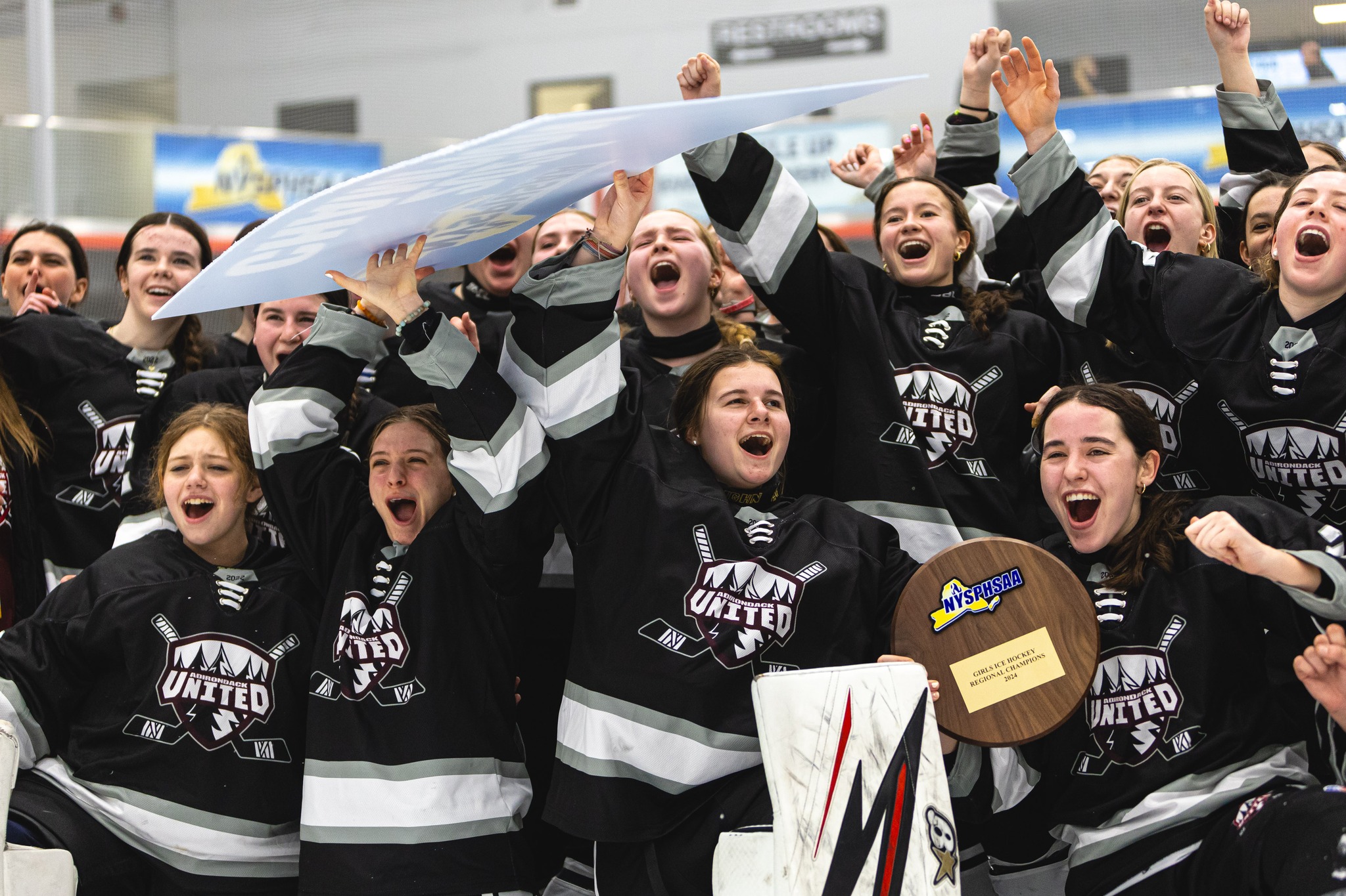 Members of the ADK United hockey team celebrate their 2024 State Championship win