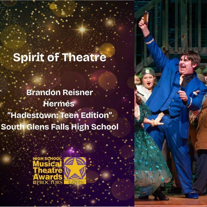 Group of people on stage with one person in the center holding an award and gesturing. Background text reads: 'Spirit of Theatre – Brandon Reisner, Hermès, Hadestown: Teen Edition, South Glens Falls High School.' Bottom left corner features the 'High School Musical Theatre Awards at Proctors' logo with the year 2023.