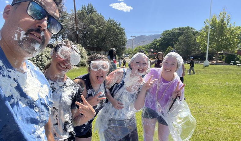 A photo of staff covered in cream pie at the Field Trip day celebration.