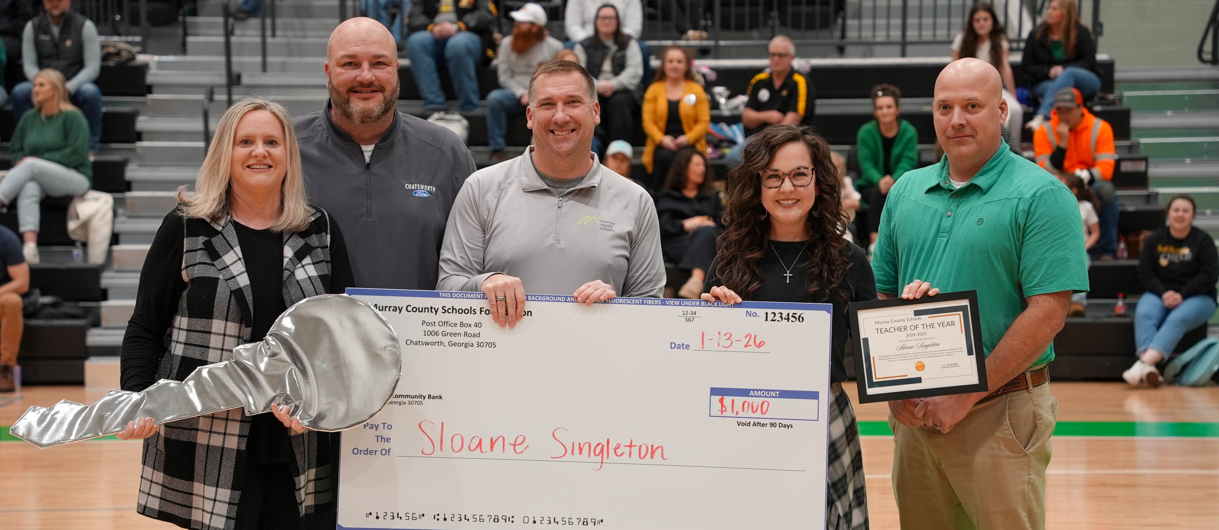 Check presentation for Teacher of the Year Sloane Singleton
