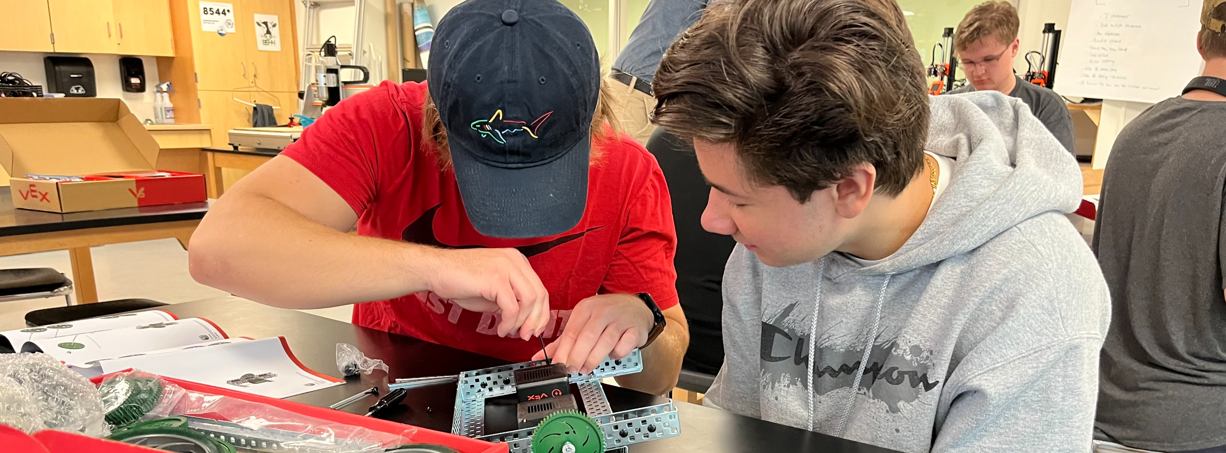 Two students working on robotics