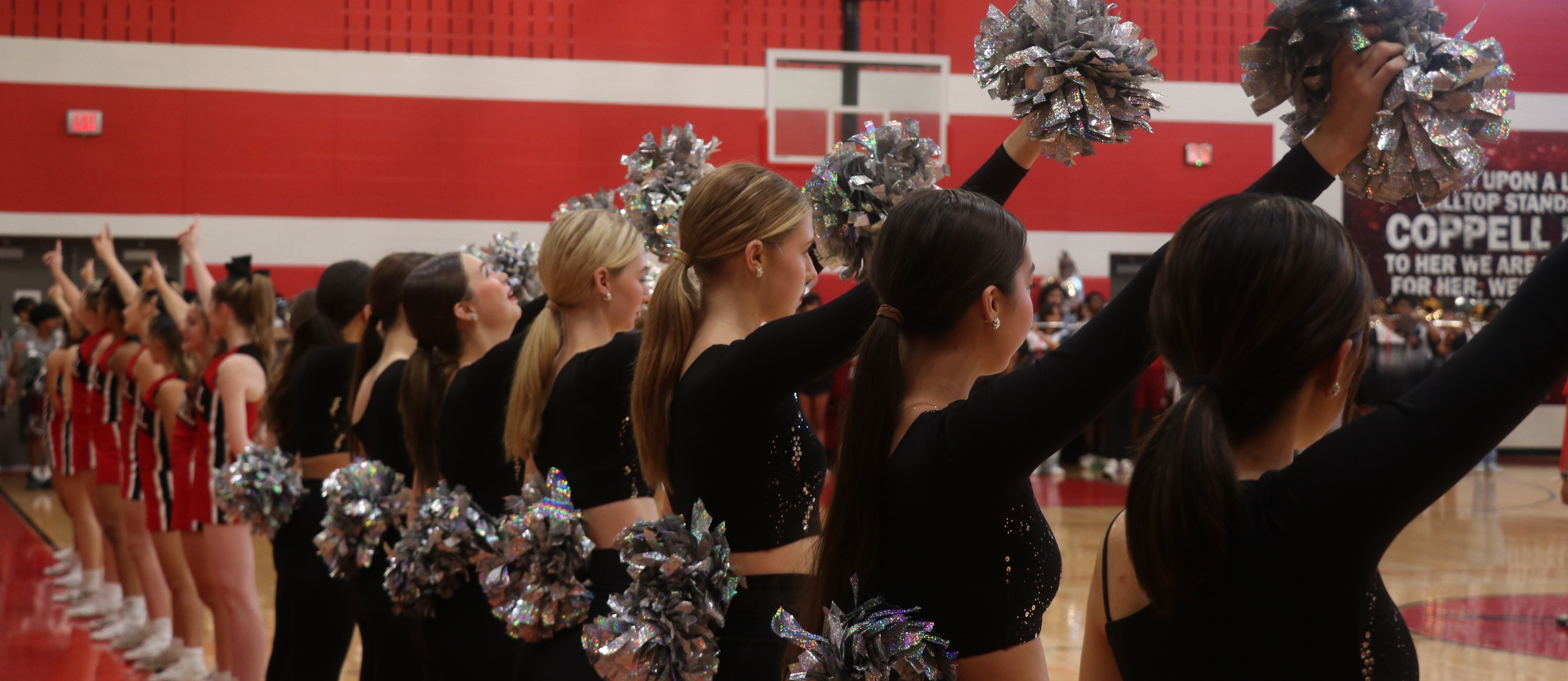 Freshman cheerleaders and silver stars pictured at a CHS9 pep rally during the singing of the school song.