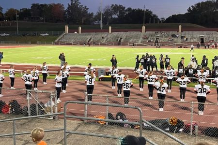 Cheer team gets the crowd amped up during a football game fall 2022.