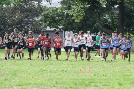 East High boy’s cross country team takes off at Riverside Park. Photo courtesy of Gene Knudsen.
