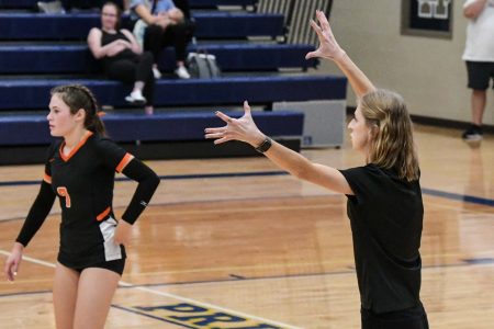 EHS volleyball coach works with Lady Raiders during the 2022 season. Photo courtesy of Gene Knudsen.