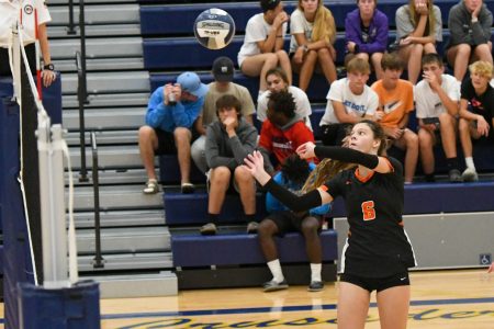 A lady Raider hits the volleyball over the net during the 2022 season. Photo courtesy of Gene Knudsen.