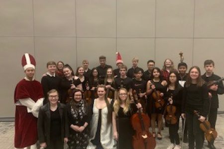 Members of the NHS Orchestra Pose for a Group Photo at the 2019 Madrigal Performance 