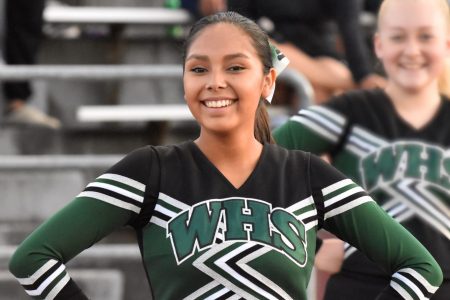 WHS Cheer Team Member Smiles for Photo at Football Game Photo by Gene Knudson
