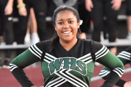 WHS Cheer Team Member Smiles for Photo at Football Game Photo by Gene Knudson