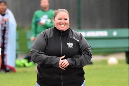 WHS Girls Soccer Coach Smiles for Photo